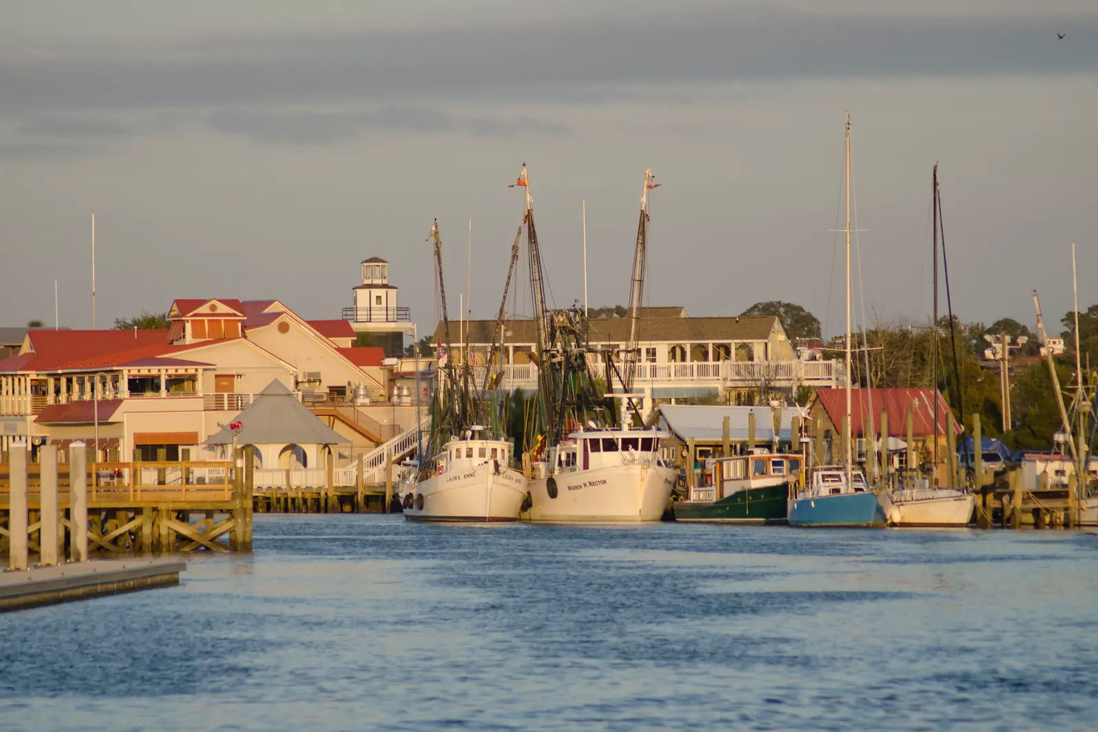 Shrimp boats docked on Shem Creek at dusk in Mount Pleasant, SC